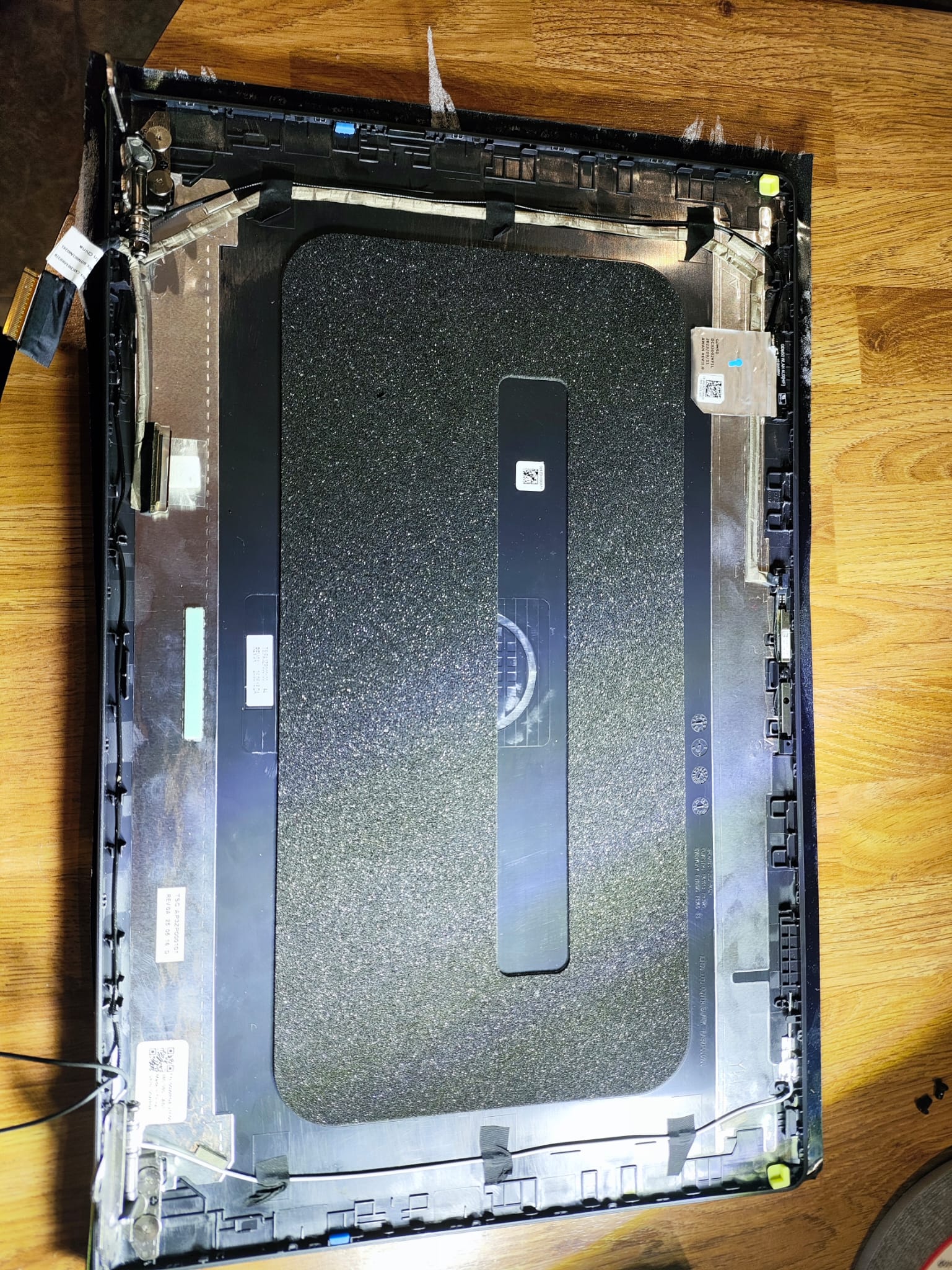 Dismantled Dell display assembly during LCD panel and cable transfer