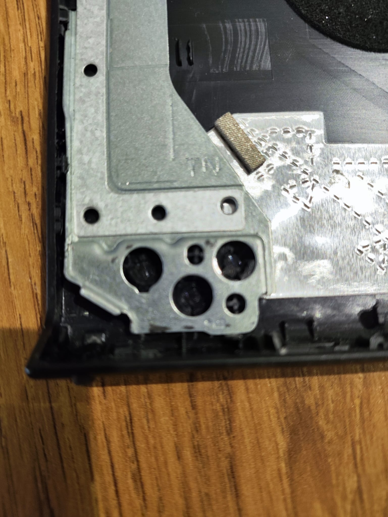 Damaged Dell Inspiron rear display cover after hinge failure